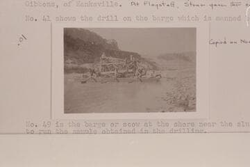 Shows the Keystone Drilling Machine on the barge which is manned by sweeps