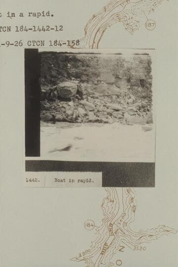 Boat in Rapid 43 at Mile 184.1.  Photo captioned "Boat in a rapid."