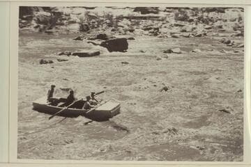 Running Government Rapid on the San Juan. Frank E. Frost, Skipper at the oars. D. A. Miller sits aft. Samuel Johnson left in front and Dr. Sherman A. Wengerd to the right