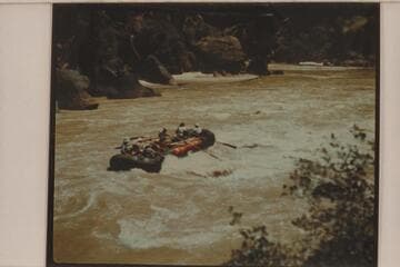 One of the Hatch pontoons in tail waves of Triplet Rapid; Canyon of Lodore. Frank Hatch and Dave Allan, boatmen. Passengers are members of Appalachian Mountain Club